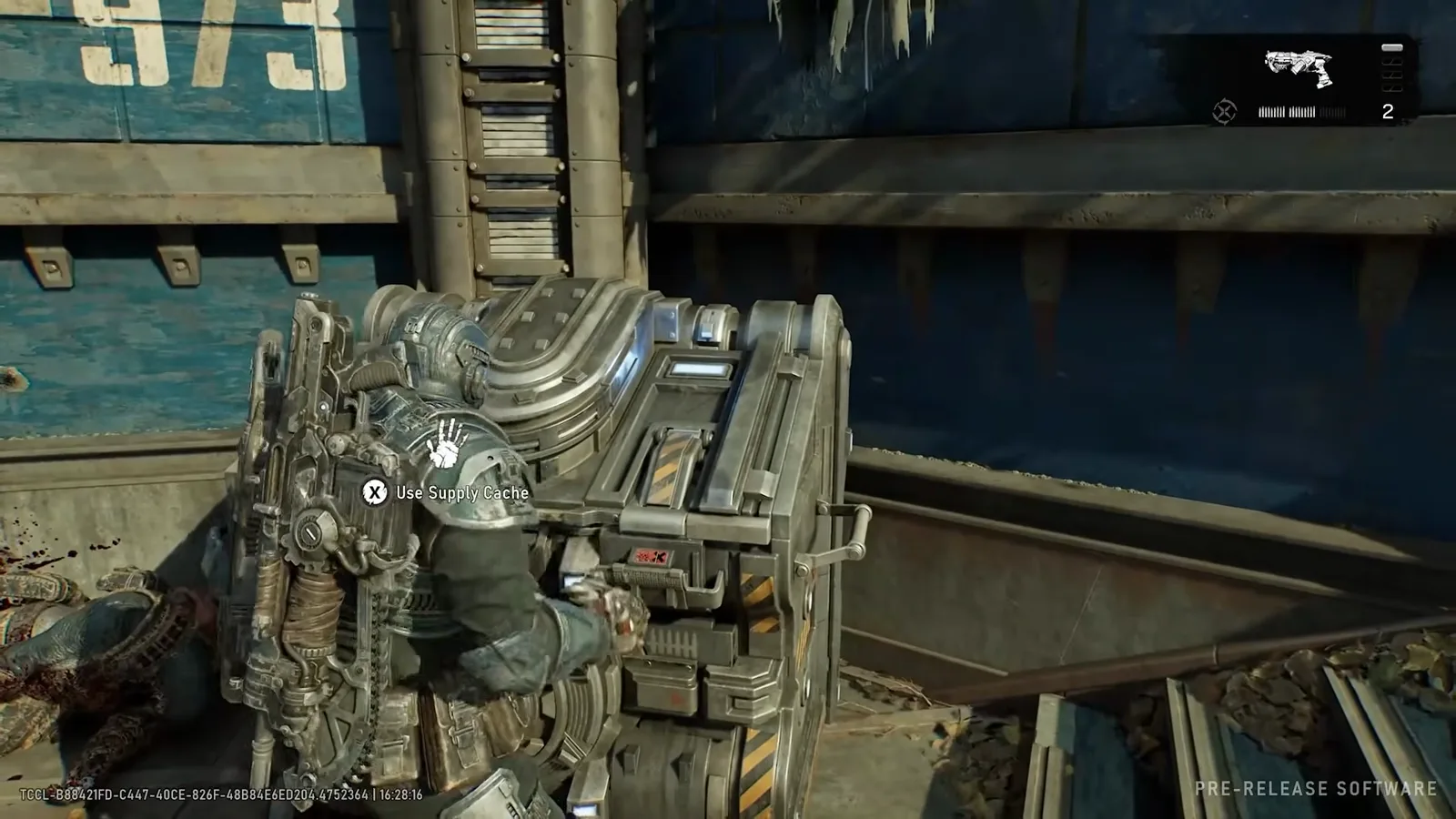 Gear interacting with a Use Supply Cache prompt in a rail yard while carrying the Striga, its icon and two-round magazine visible in the HUD